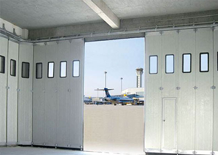 Round the corner hangar door