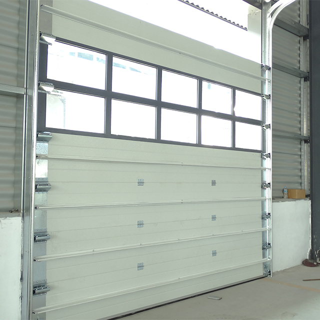 Industrial sectional door for warehouse