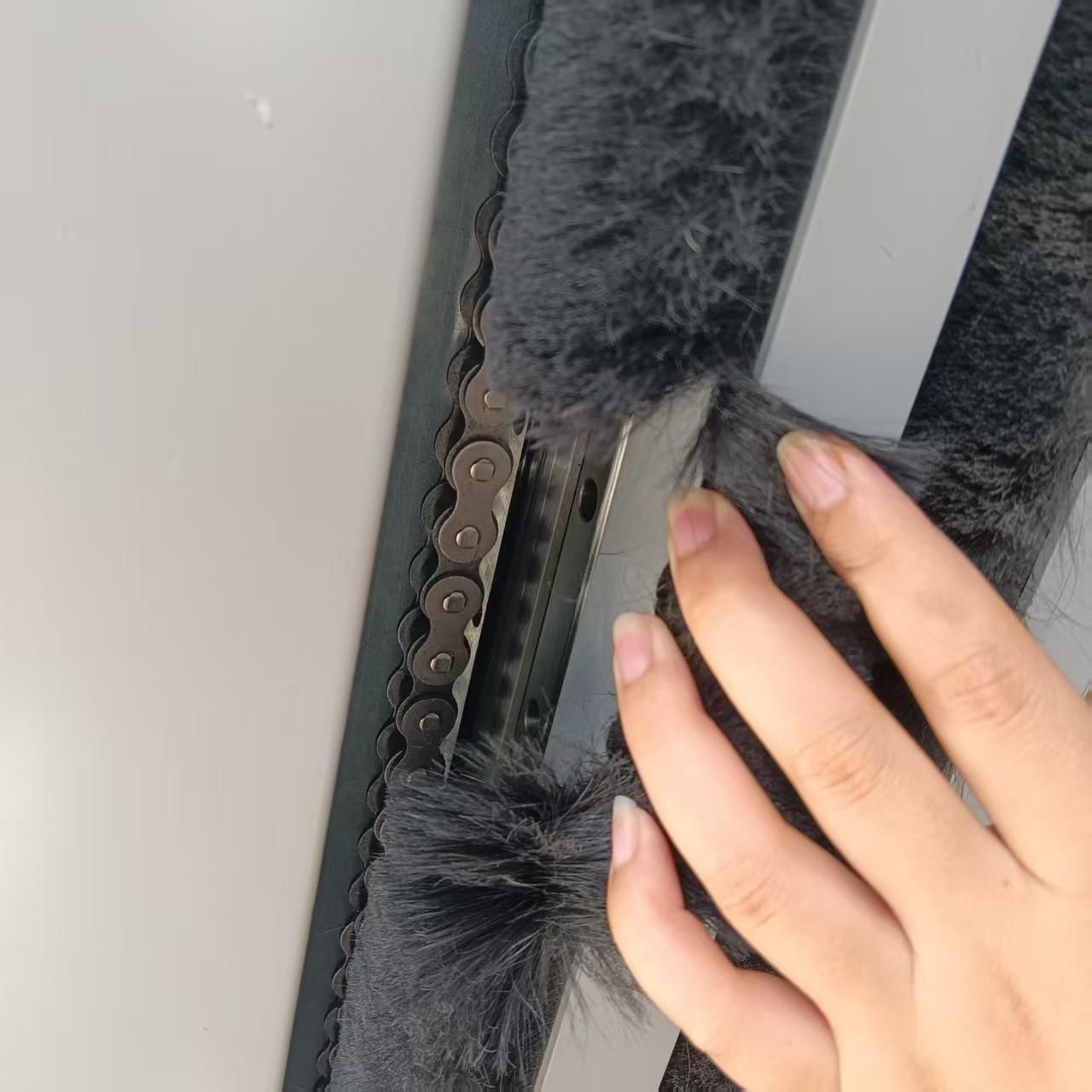 Vertical bifold up door brush